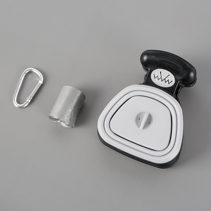 Foldable dog poop bag dispenser with built-in spoon. 